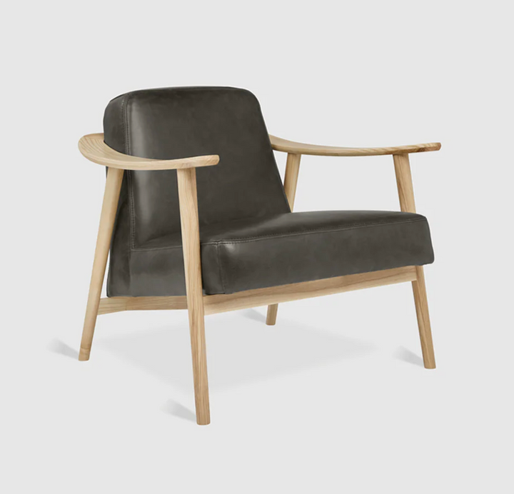 Dark leather armchair with light oak frame, modern minimalist design