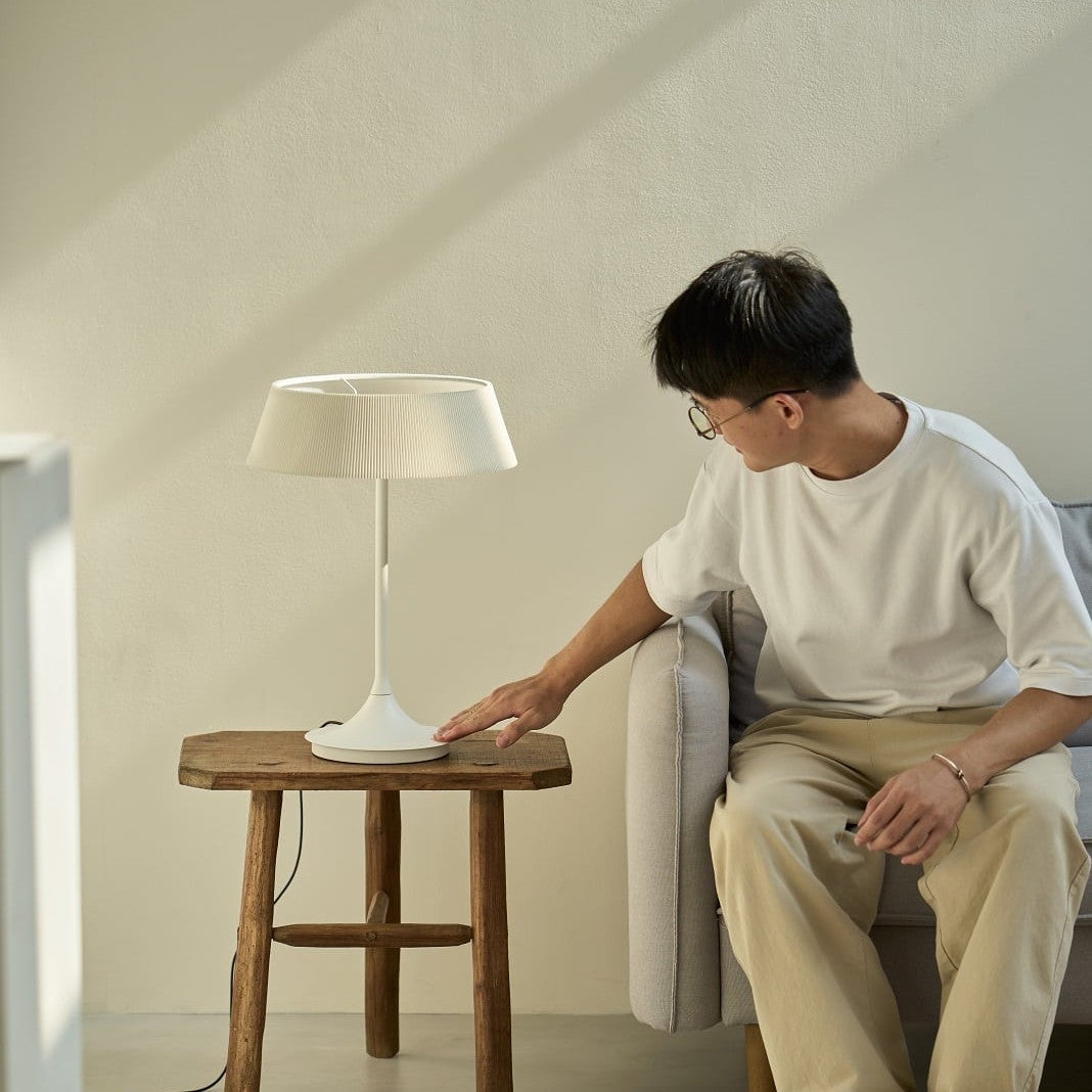 Halo Table Lamp by Seed Design, styled in a room setting