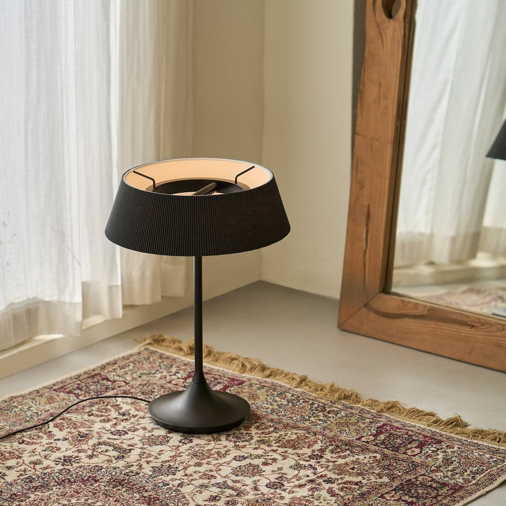 Halo Table Lamp by Seed Design in Black, styled in a room setting