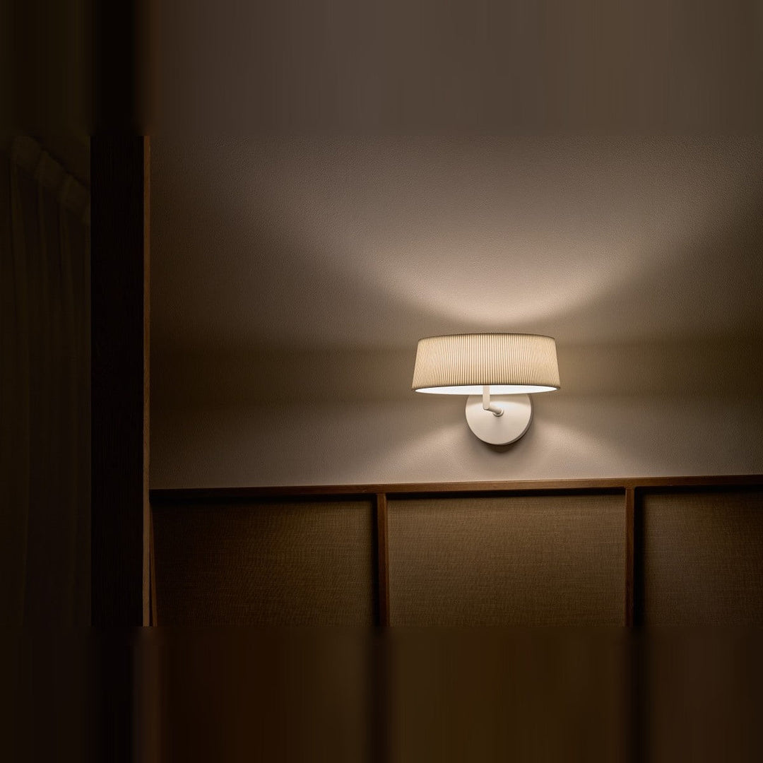 Halo Wall Sconce by Seed Design in White, styled in a room setting