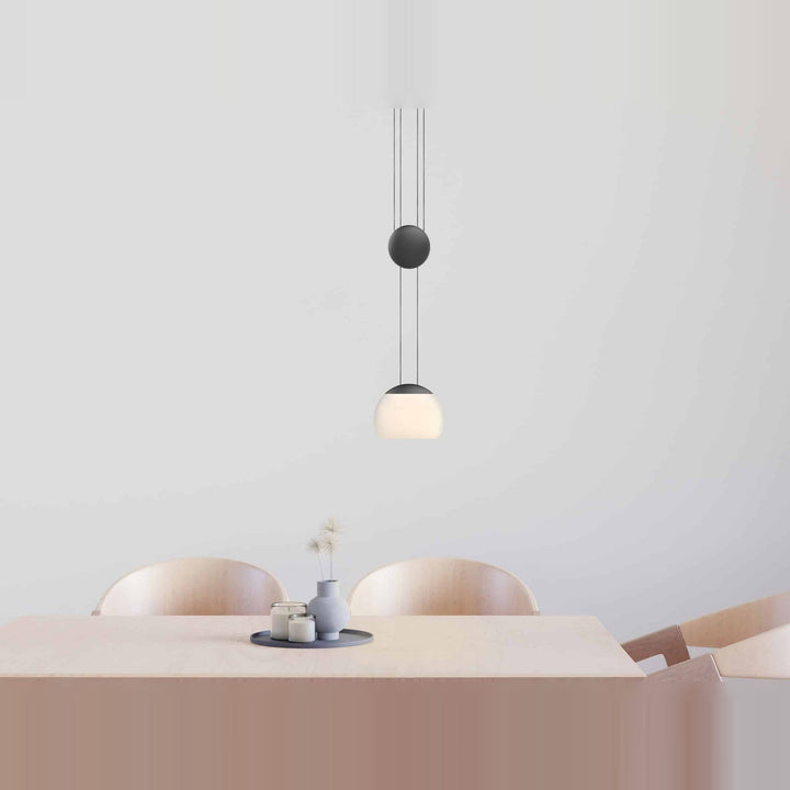 Jojo LED Pendant by Seed Design in Black, styled in a room setting