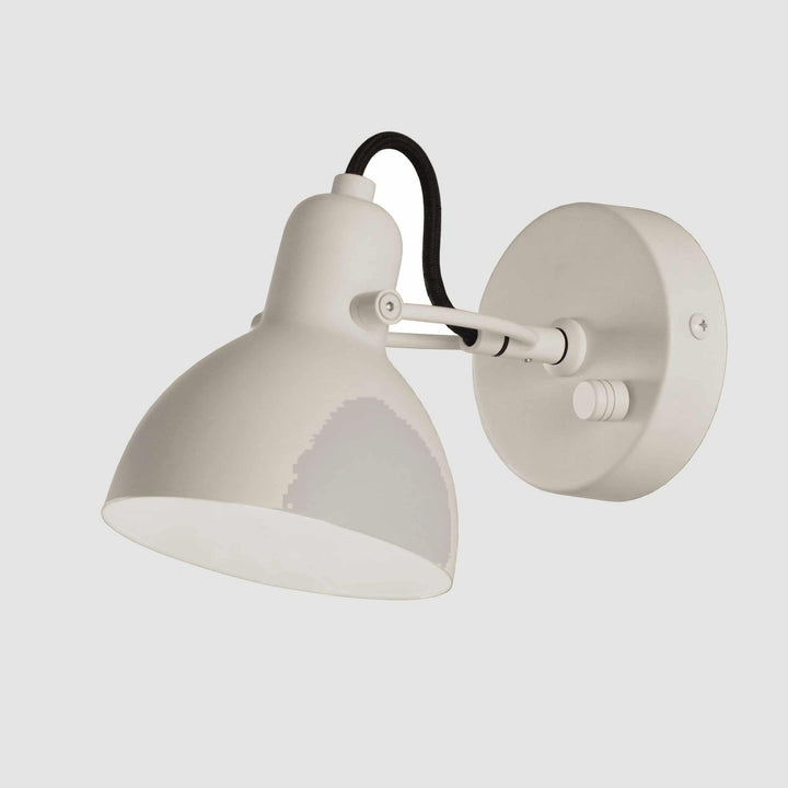 Laito Mini Wall Sconce by Seed Design in White, studio shot