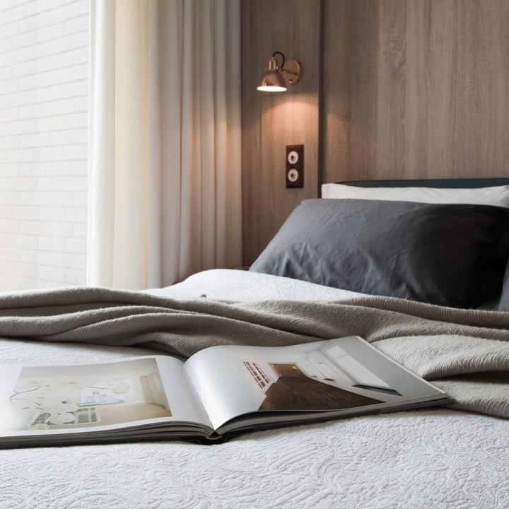 Laito Mini Wall Sconce by Seed Design, styled in a room setting, view 2