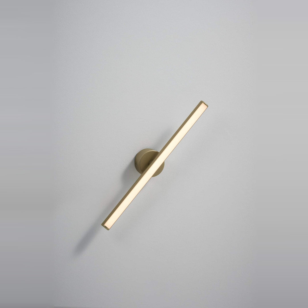 Lisa Wall Sconce by Seed Design in Champagne Gold, styled in a room setting