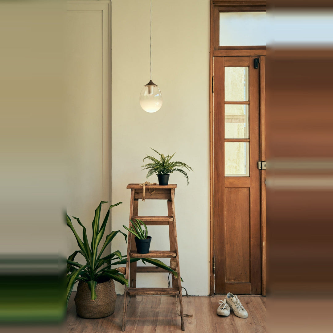 Mist LED Pendant by Seed Design, styled in a room setting