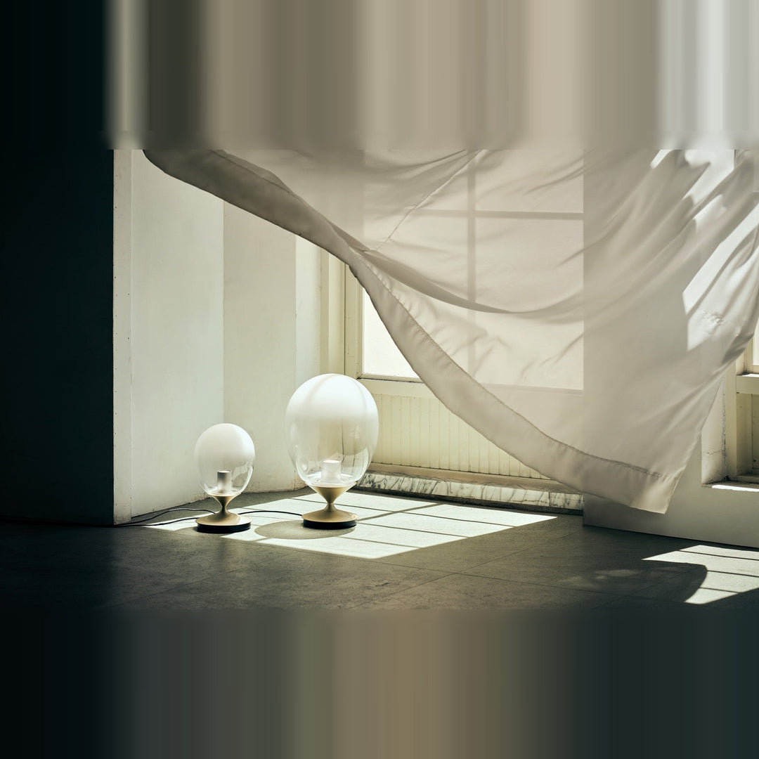 Mist LED Table Lamp by Seed Design, styled in a room setting, view 6