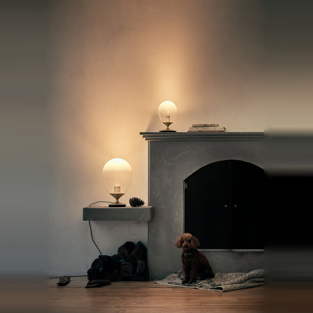 Mist LED Table Lamp by Seed Design, styled in a room setting