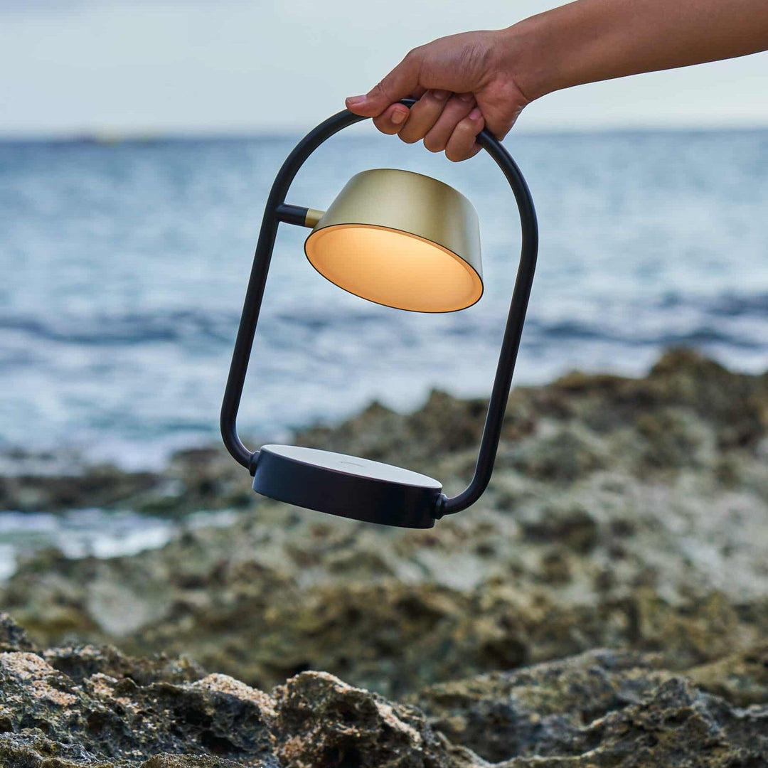 Olo Ring Portable Table Lamp by Seed Design, styled in a room setting