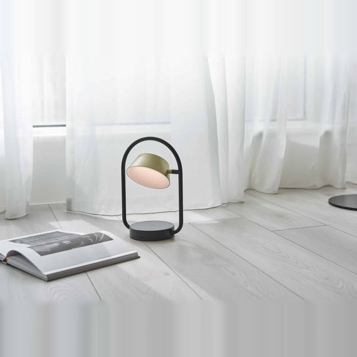 Olo Ring Portable Table Lamp by Seed Design in Champagne Gold, styled in a room setting