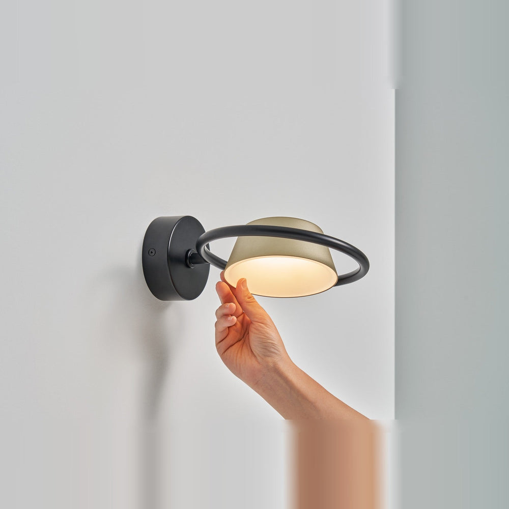 Olo Ring Wall Lamp by Seed Design in Champagne Gold, styled in a room setting