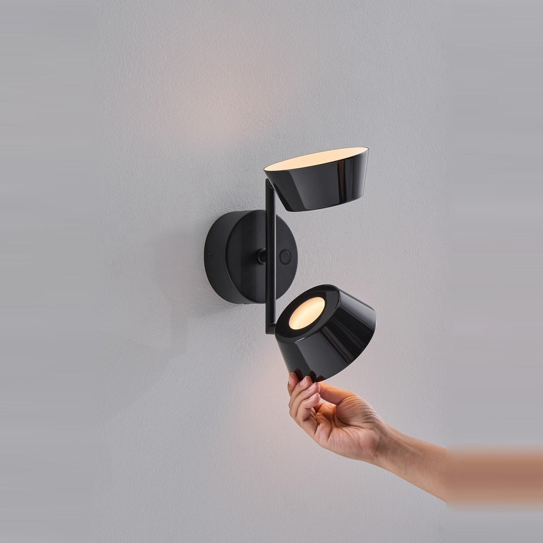 Olo W2 Wall Sconce by Seed Design in Black, studio shot