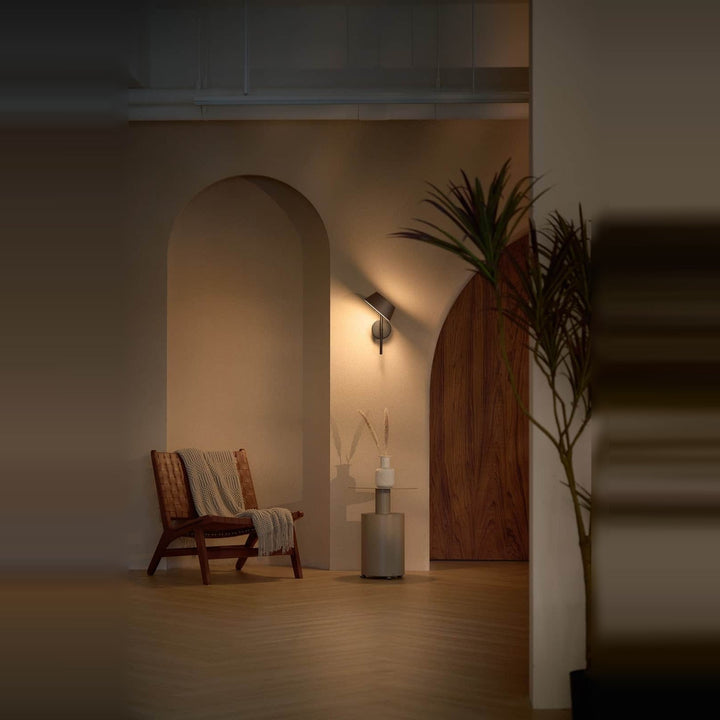 Olo XL Wu Wall Sconce by Seed Design, styled in a room setting
