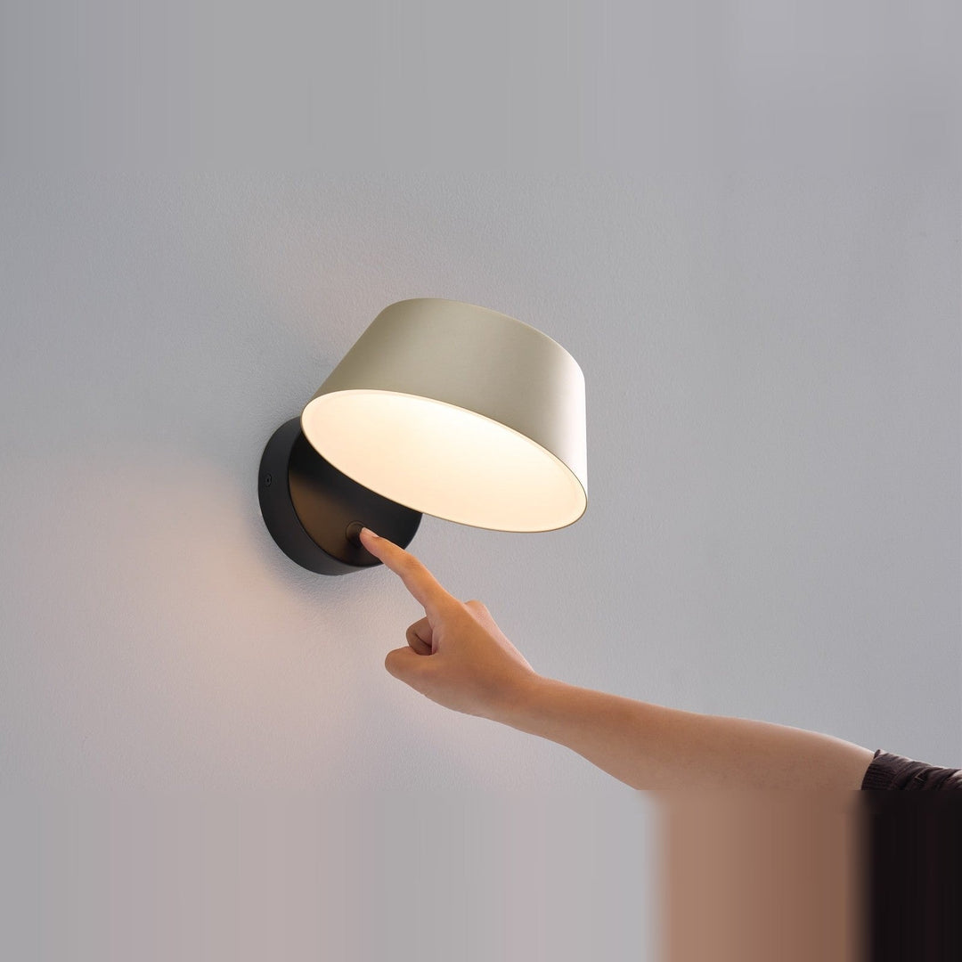 Olo XL Wall Sconce by Seed Design in Champagne Gold, styled in a room setting