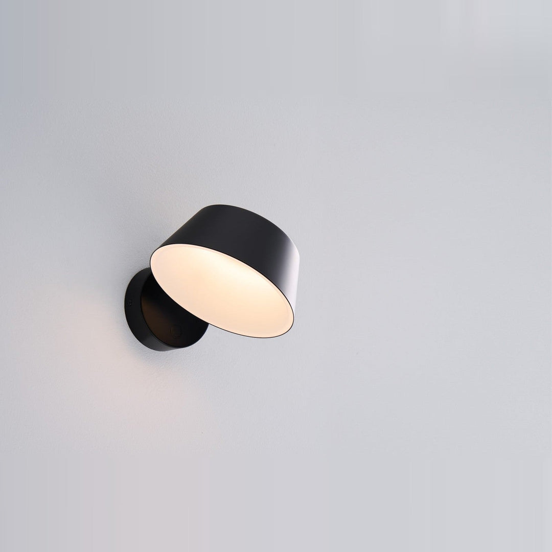 Olo XL Wall Sconce by Seed Design in Black, studio shot
