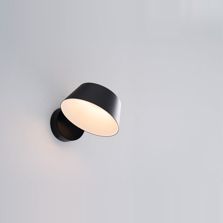 Olo XL Wall Sconce by Seed Design in Black, studio shot