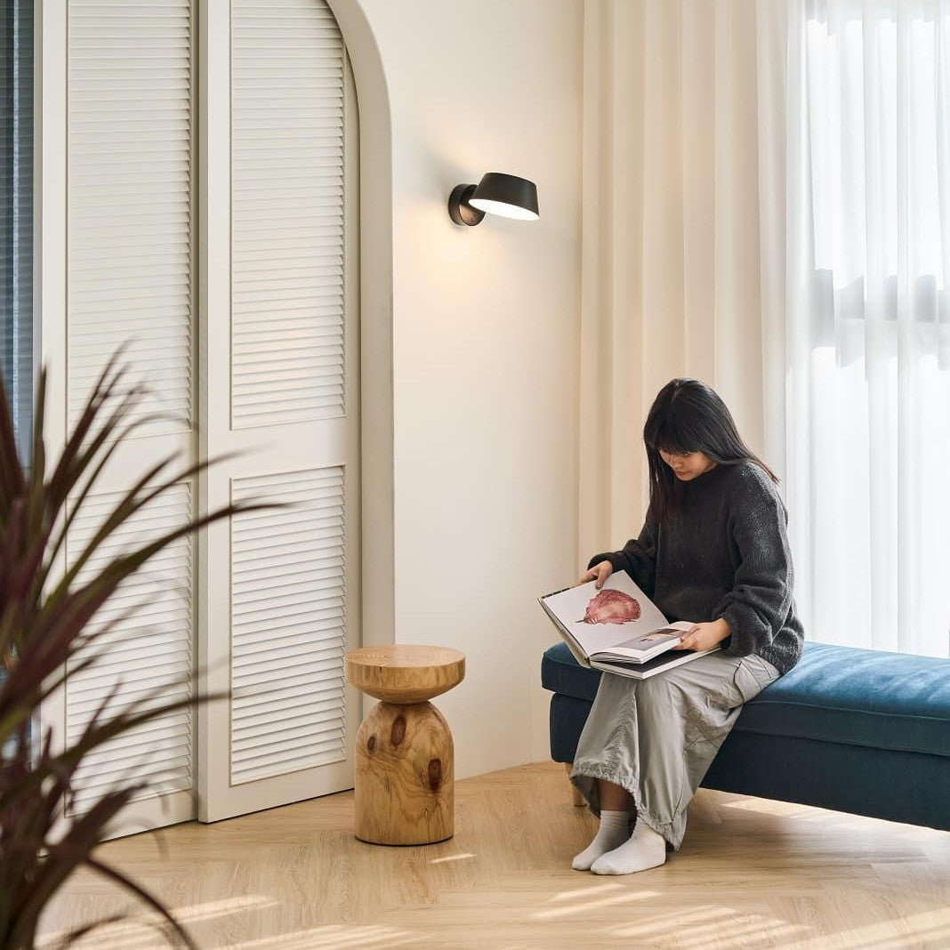 Olo XL Wall Sconce by Seed Design, styled in a room setting