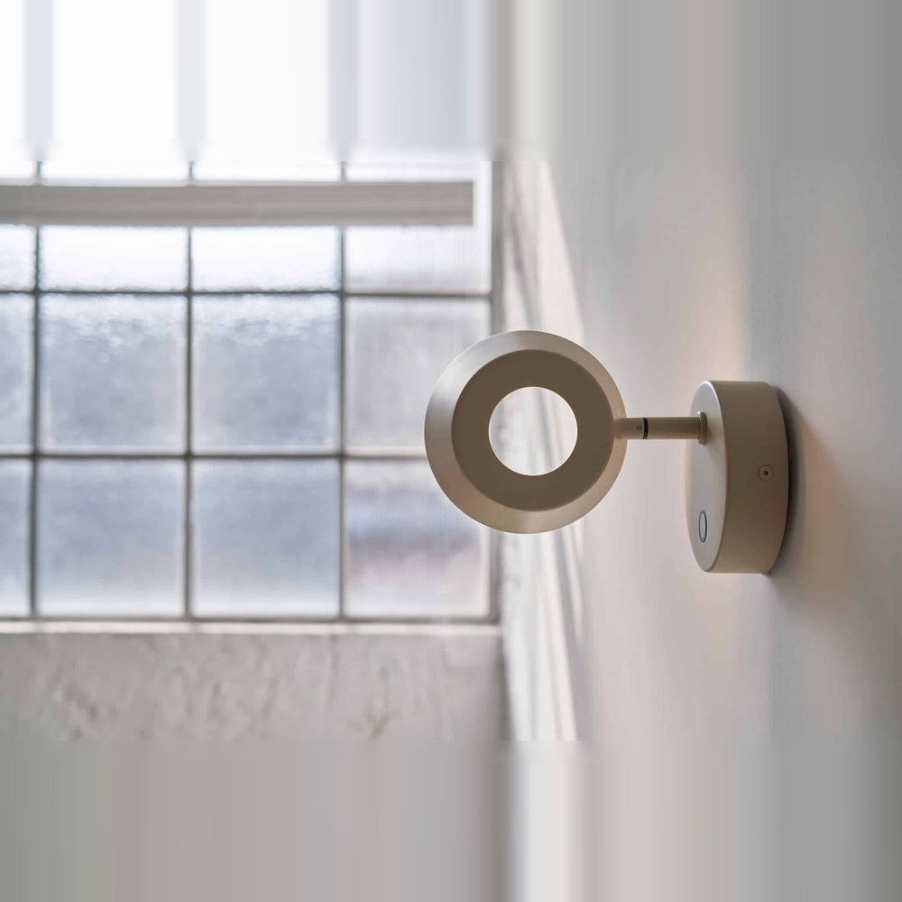 Olo Wall Sconce by Seed Design in Oatmeal, styled in a room setting