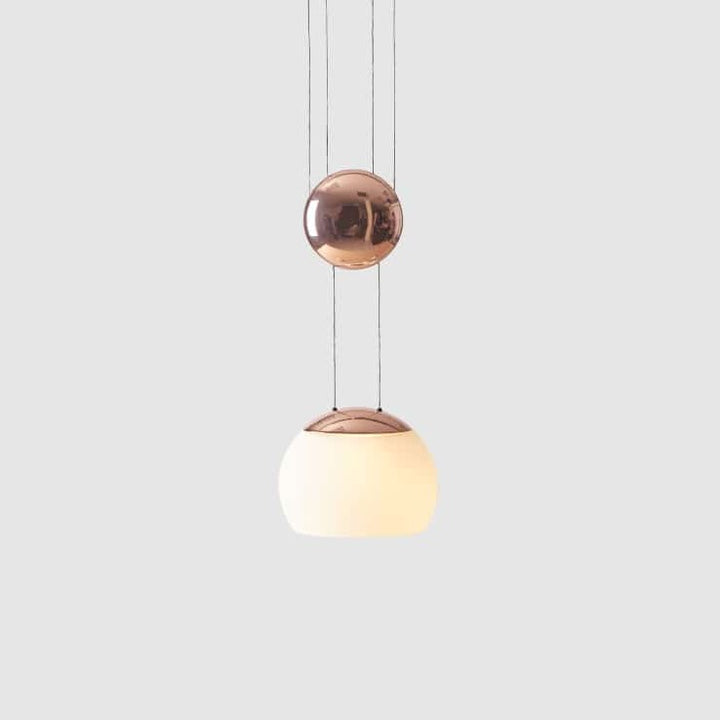 Jojo LED Pendant by Seed Design in Copper, studio shot