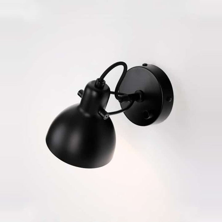 Laito Mini Wall Sconce by Seed Design in Black, studio shot