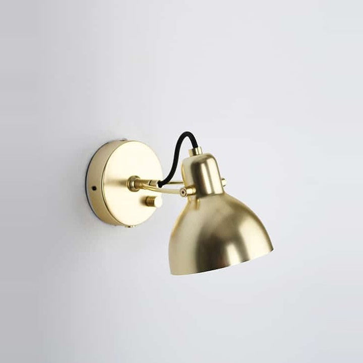 Laito Mini Wall Sconce by Seed Design in Brass, styled in a room setting