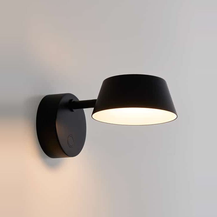 Olo Wall Sconce by Seed Design in Black, styled in a room setting