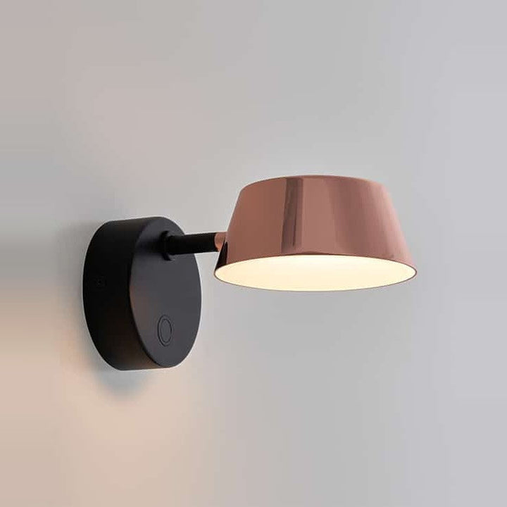 Olo Wall Sconce by Seed Design in Copper, styled in a room setting