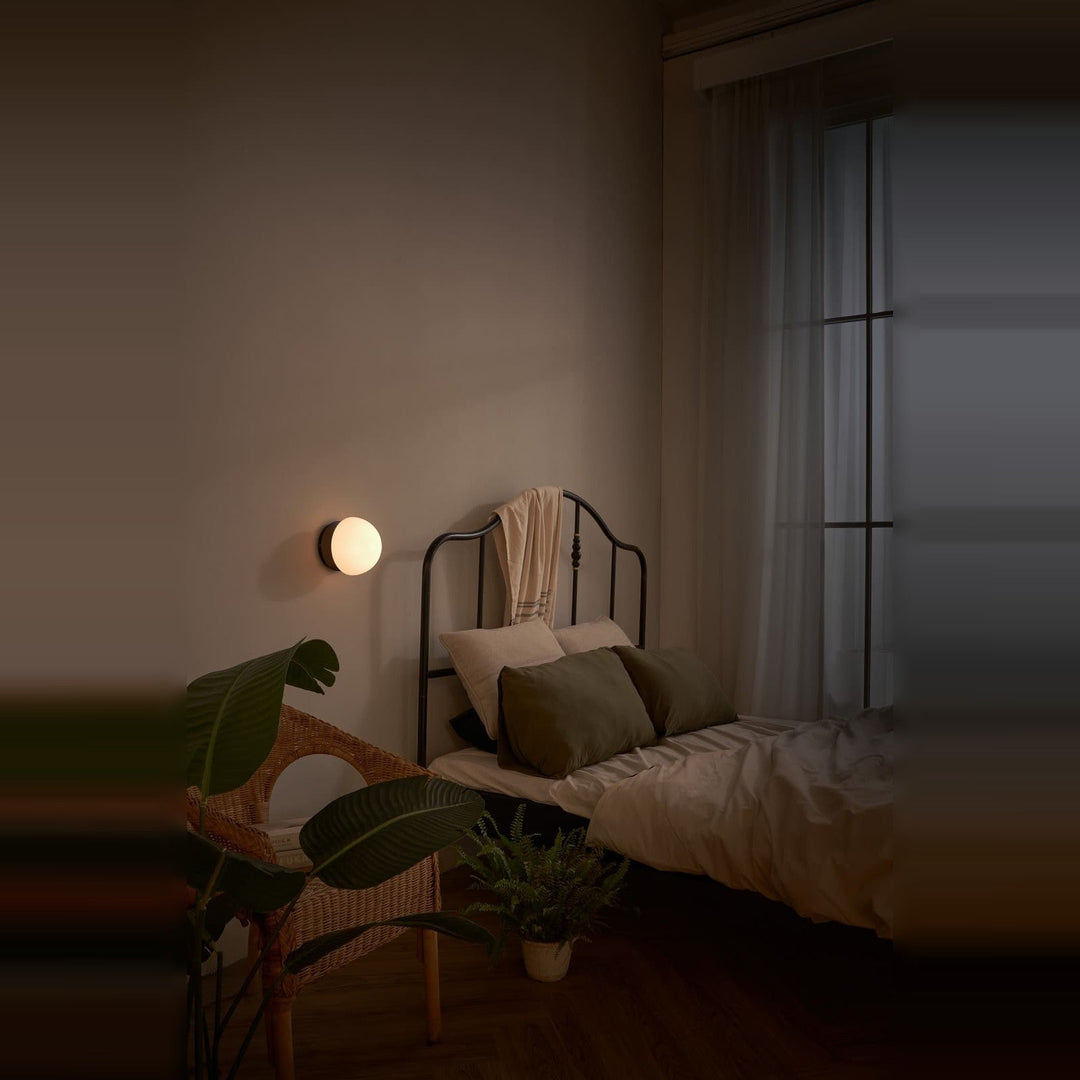 Pensee Wall Sconce by Seed Design, styled in a room setting, view 6