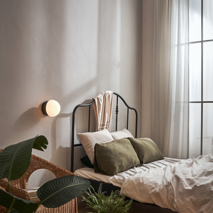 Pensee Wall Sconce by Seed Design, styled in a room setting, view 7