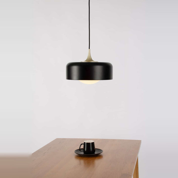 Pensee L Pendant by Seed Design in Black, styled in a room setting