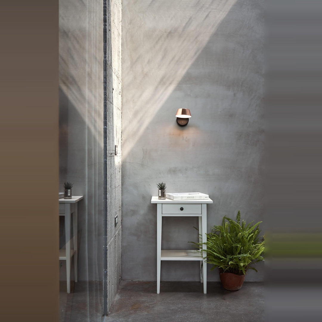 Olo Wall Sconce by Seed Design, styled in a room setting