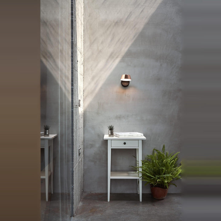 Olo Wall Sconce by Seed Design, styled in a room setting