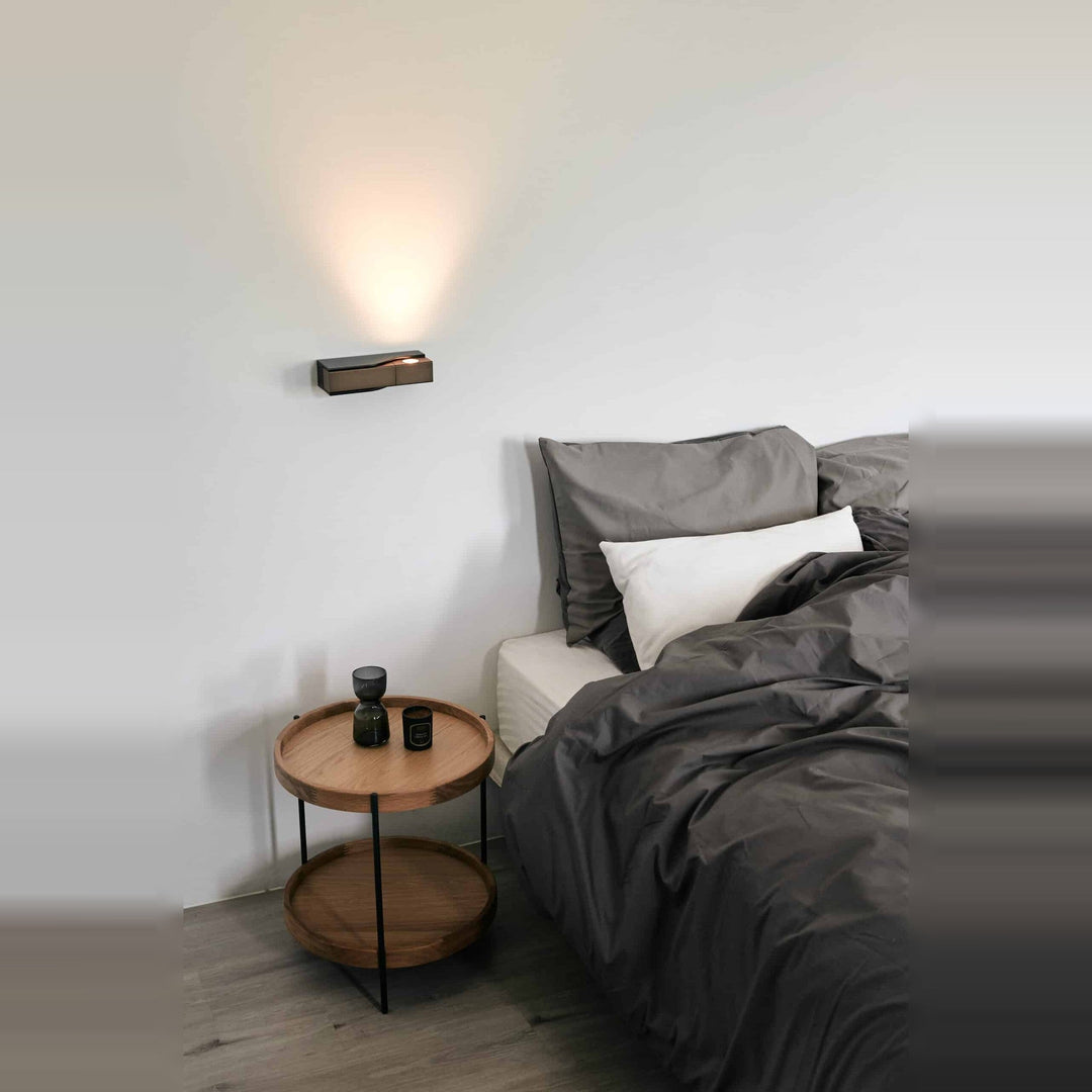 Wu Wall Sconce by Seed Design, styled in a room setting