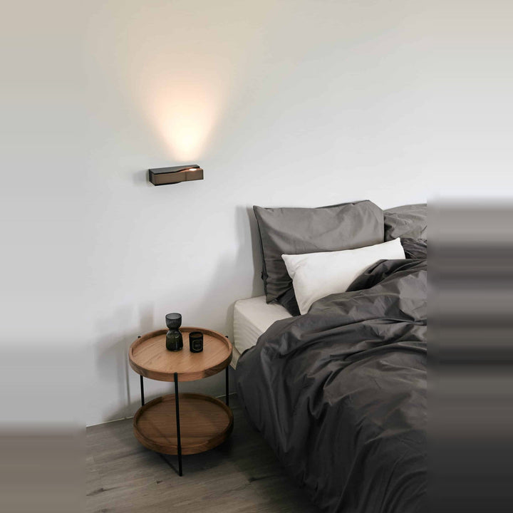 Wu Wall Sconce by Seed Design, styled in a room setting