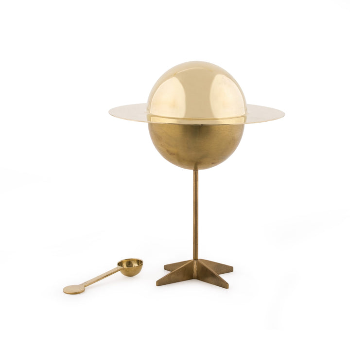 Seletti Cosmic Diner Lunar Sugar Jar, brass sphere sugar jar with a ringed lid on a tall stem, scoop alongside