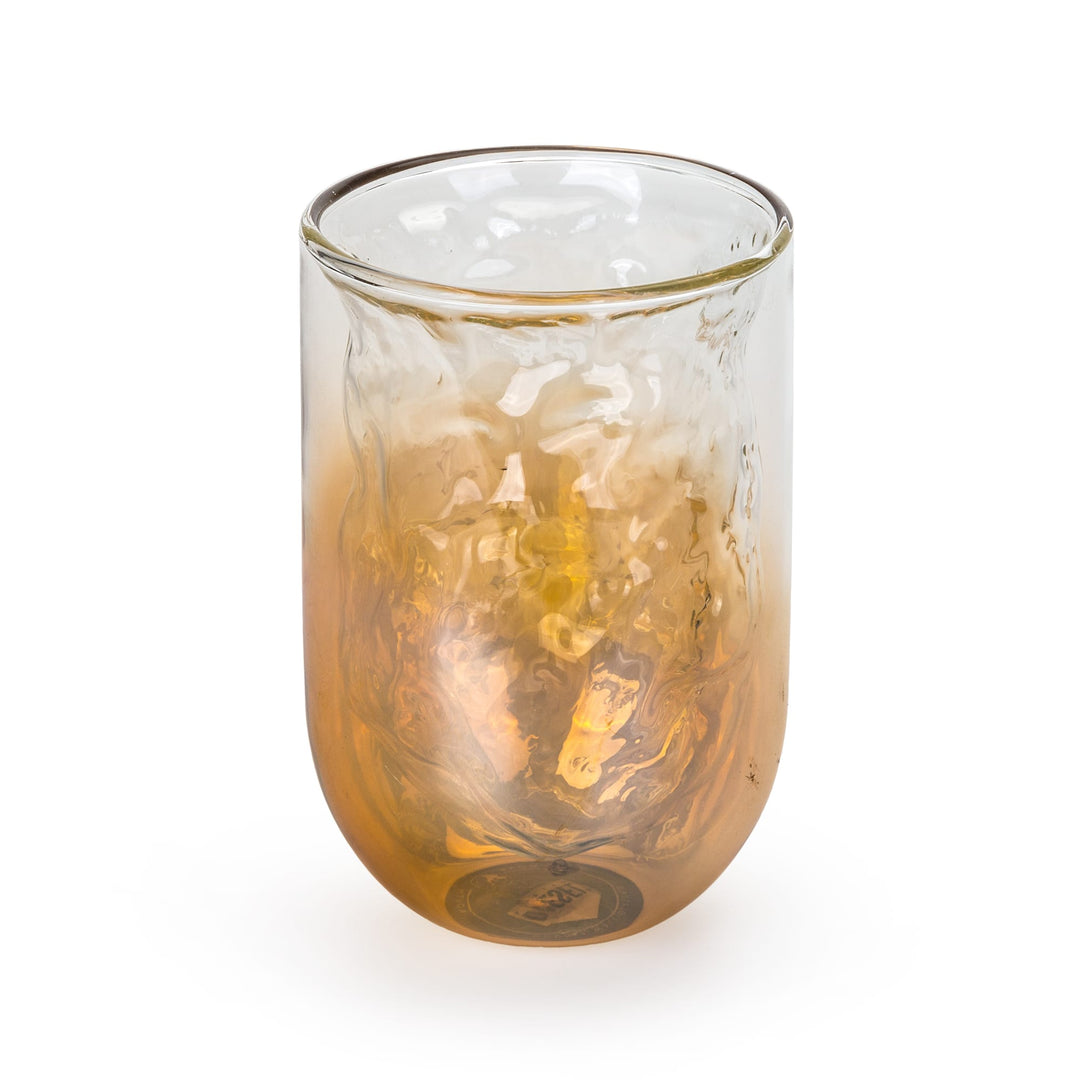 Seletti Cosmic Diner Meteorite Glass Tall, taller tumbler, clear rim melting into molten amber and gold tones