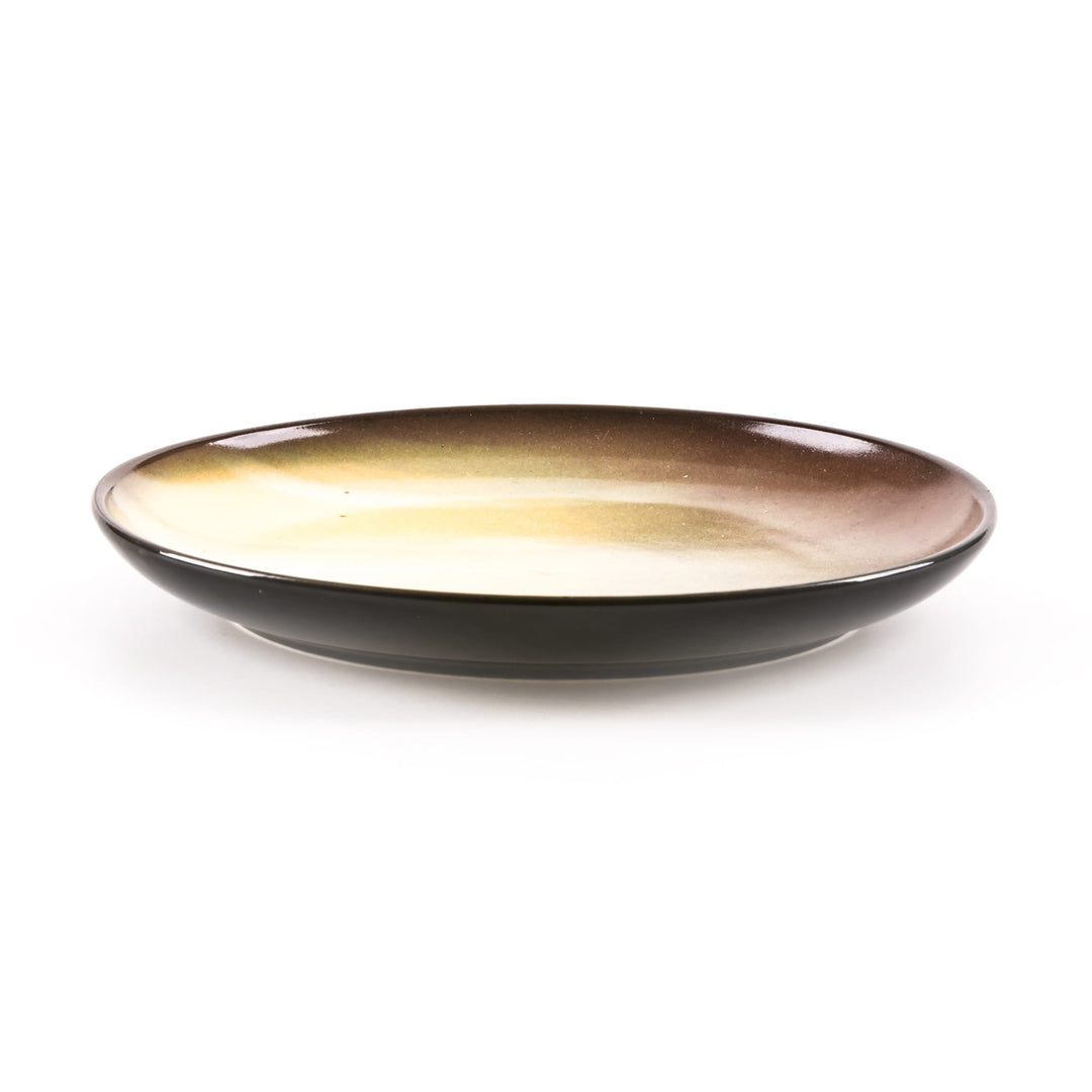 Seletti Cosmic Diner Saturn Fruit/Dessert Plate, low side view of the cream and brown banded print