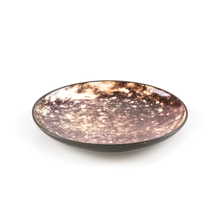 Seletti Cosmic Diner Callisto Fruit/Dessert Plate, angled view of the speckled moon print and black rim