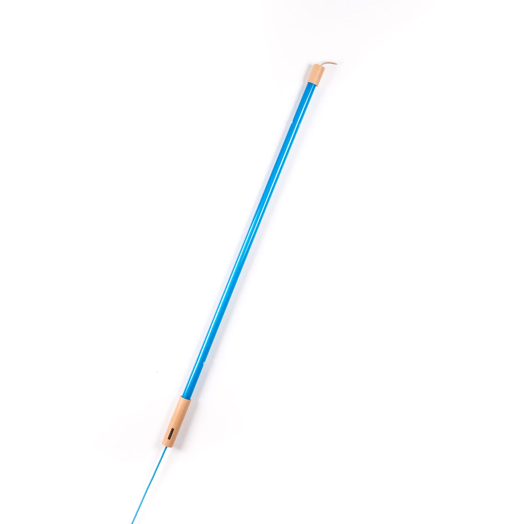 Seletti Linea LED Blue, blue tube leaning at an angle, wood end cap at the base