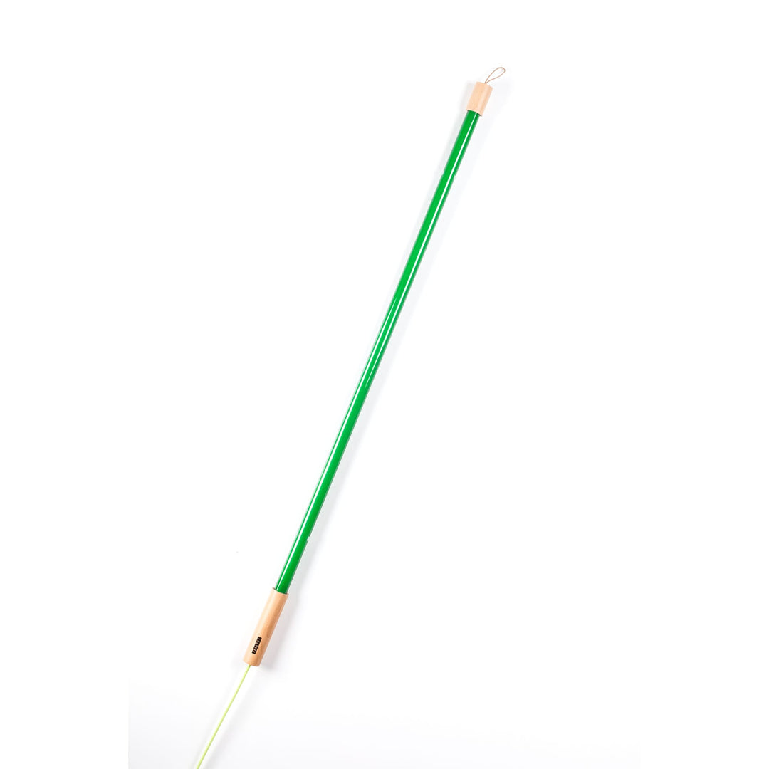 Seletti Linea LED Green, green tube leaning diagonally on white