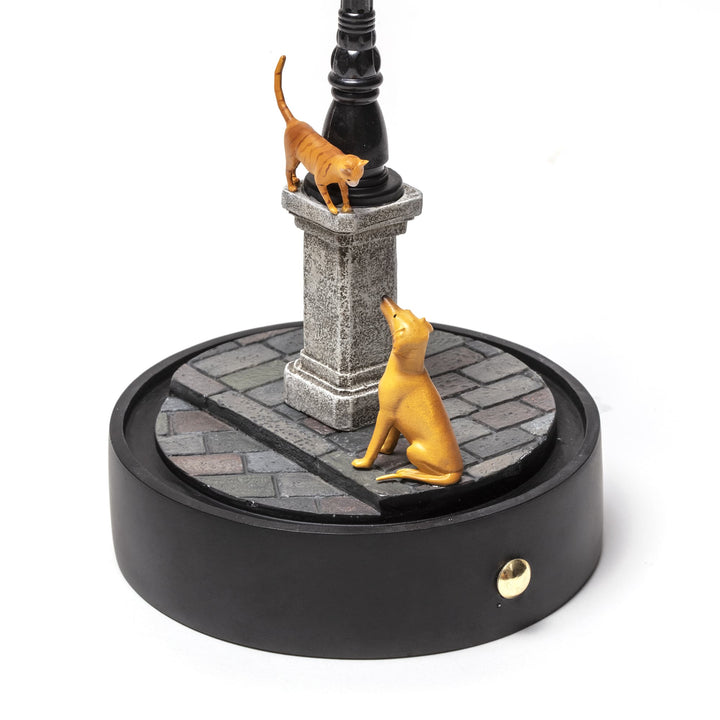 Seletti My Little Evening, close-up of the cats on the plinth and cobblestones, dome removed