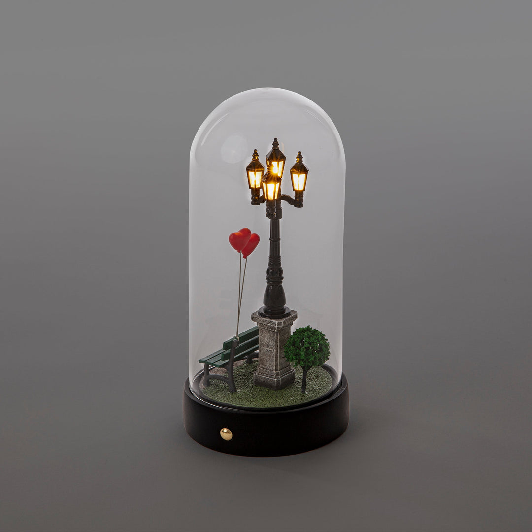 Seletti My Little Valentine, lanterns glowing over the bench, gray background