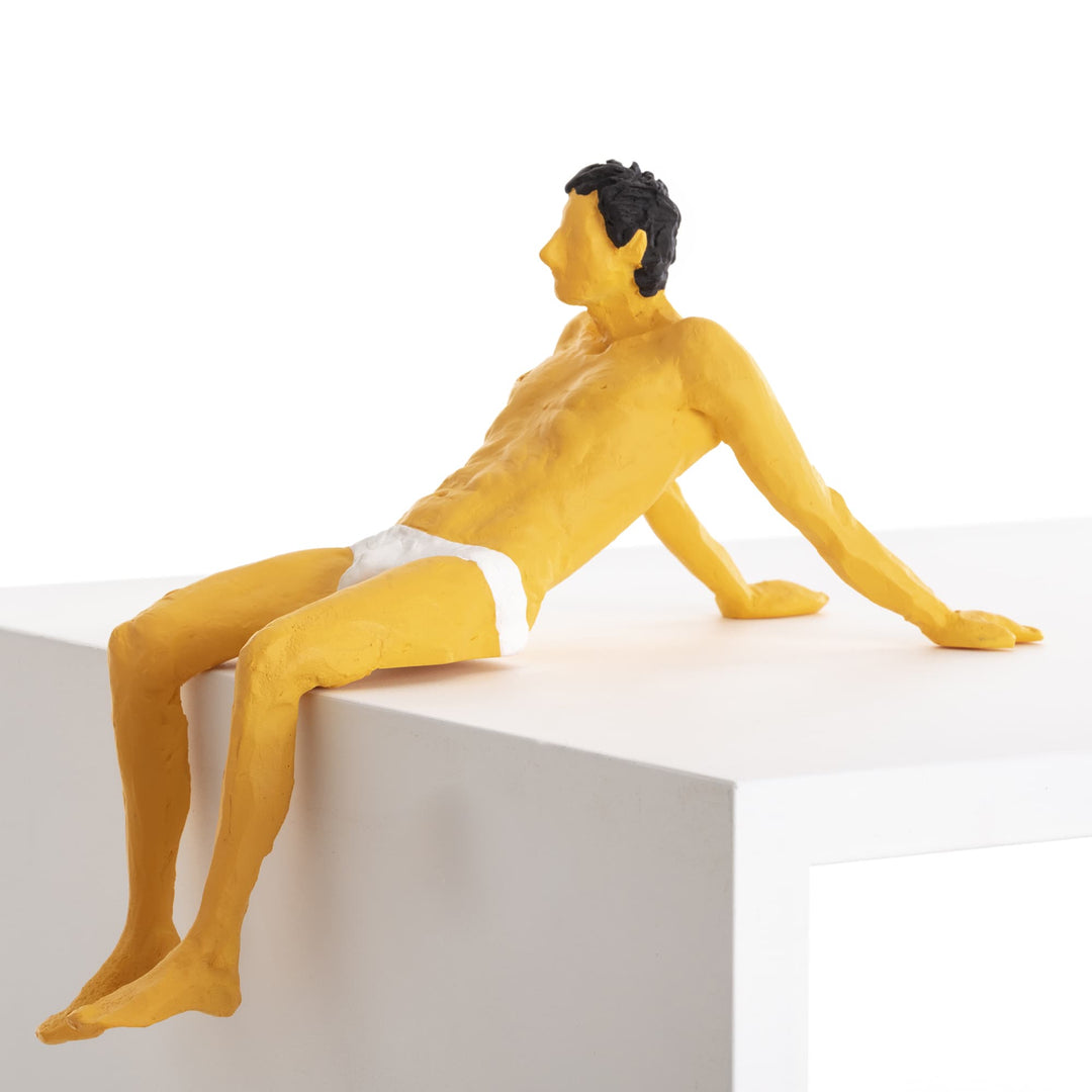 Seletti Love Is a Verb Pierrot Figurine, side view of the reclining figure in white briefs