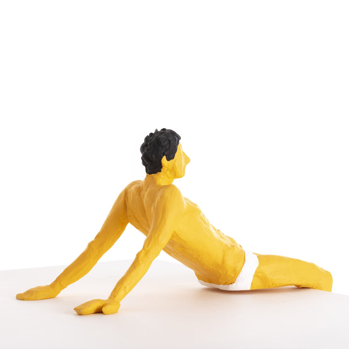Seletti Love Is a Verb Pierrot Figurine, the figure stretched out on a flat surface