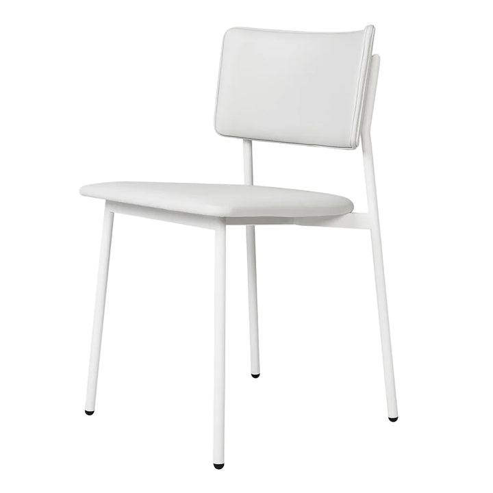 White leather dining chair with sleek metal frame, modern minimalist design