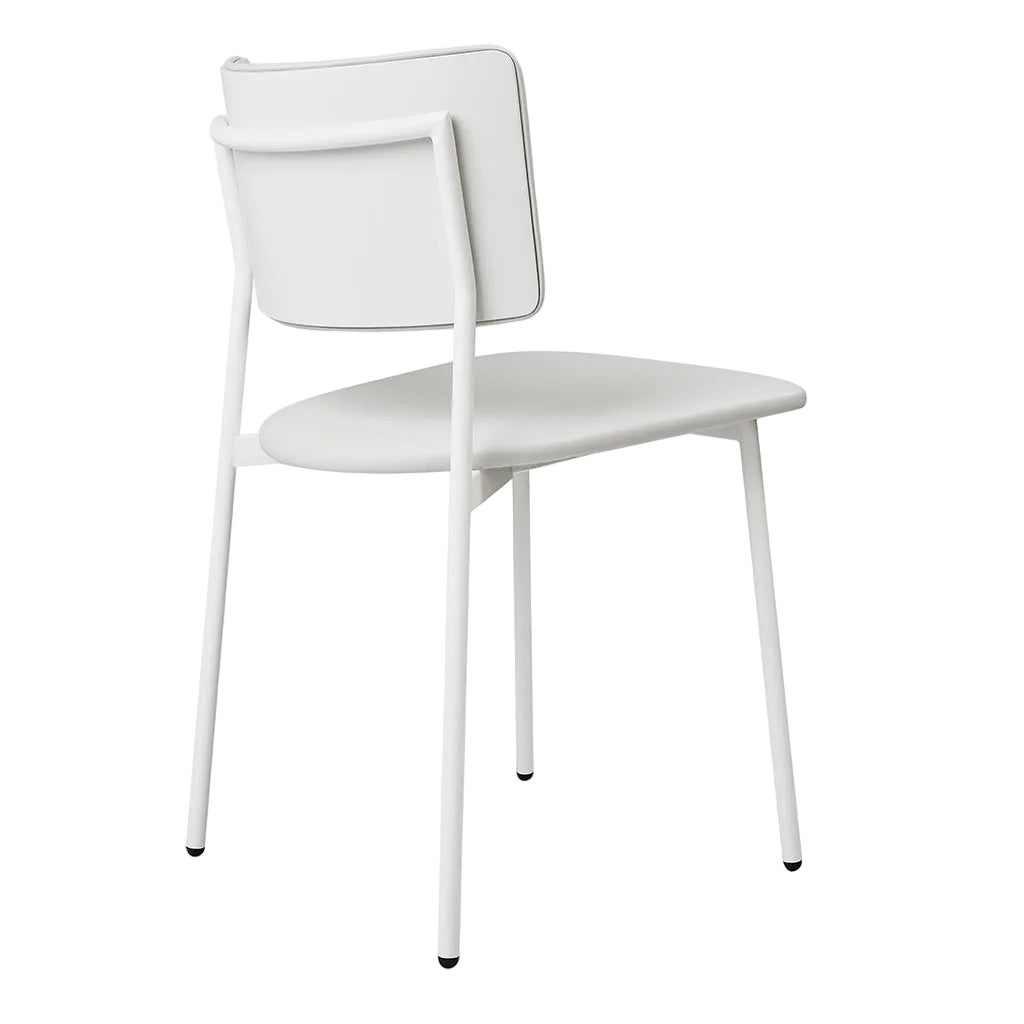 Minimalist white dining chair with sleek metal legs and modern design