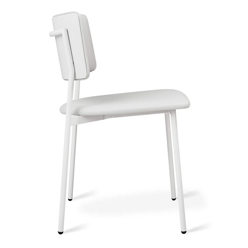 Minimalist white upholstered chair with sleek metal legs, modern designer furniture
