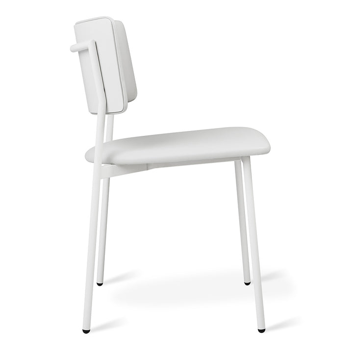 Minimalist white upholstered chair with sleek metal legs, modern designer furniture