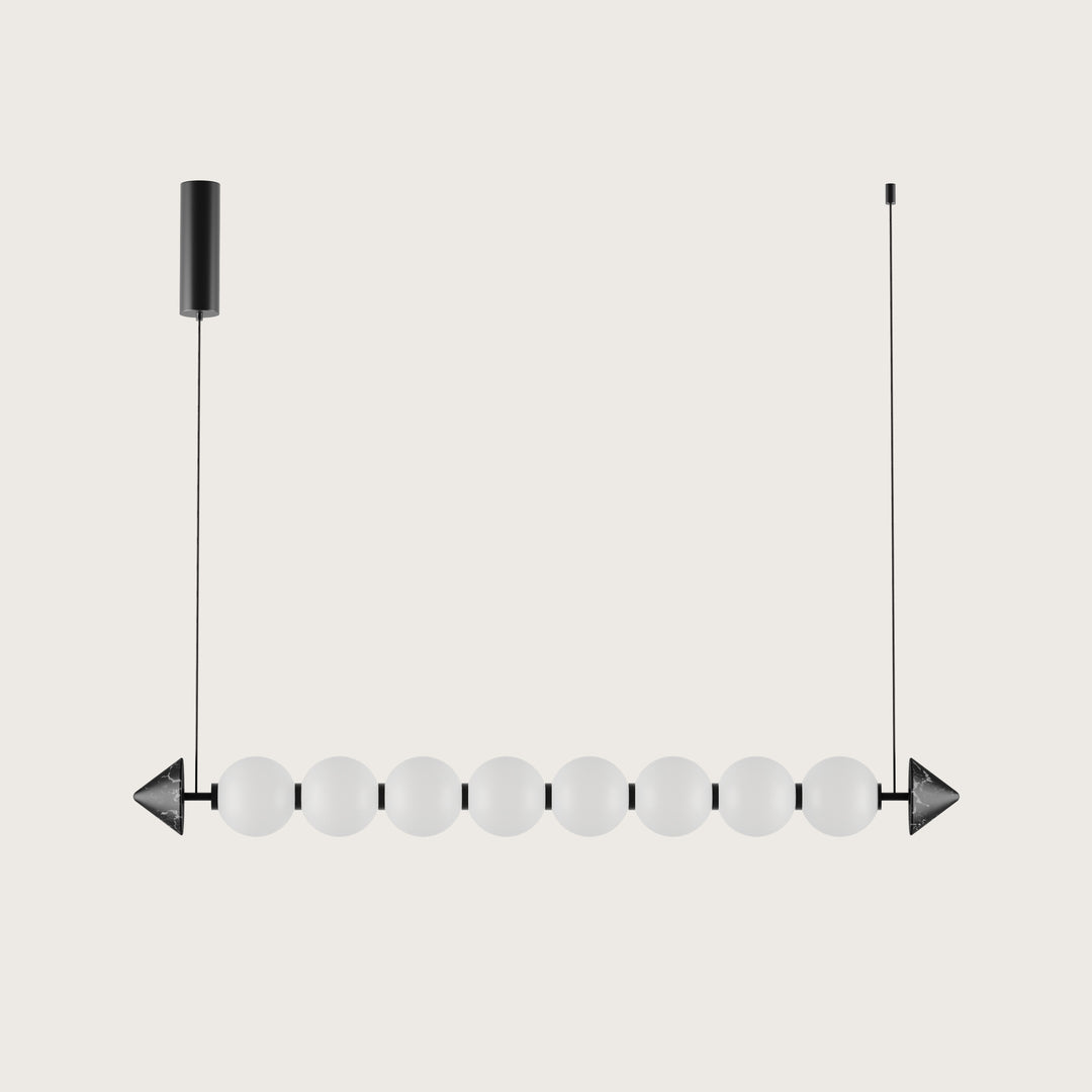 Soko Pendant Lamp, linear row of eight opal glass spheres between dark marble cone ends, by Aromas del Campo