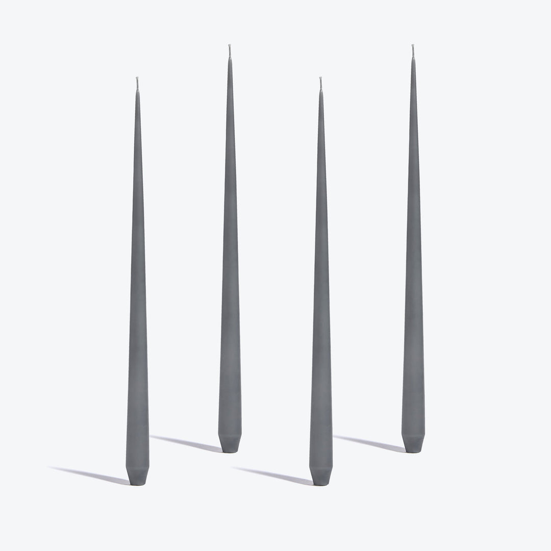Tapered Candle, Set of 4 — four tall Light Grey candles standing upright on a white background