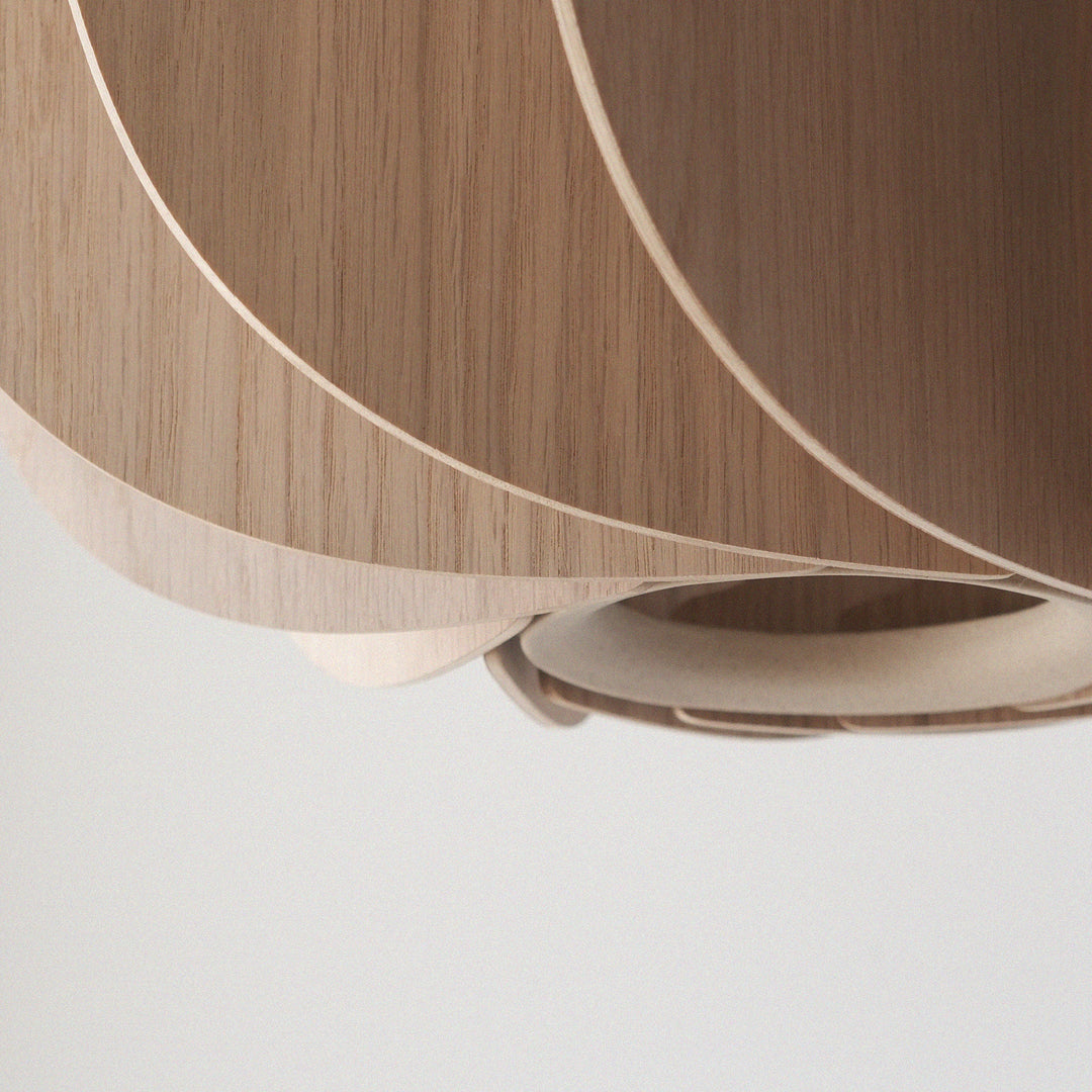 Layered oak wood pendant light with sculptural curves